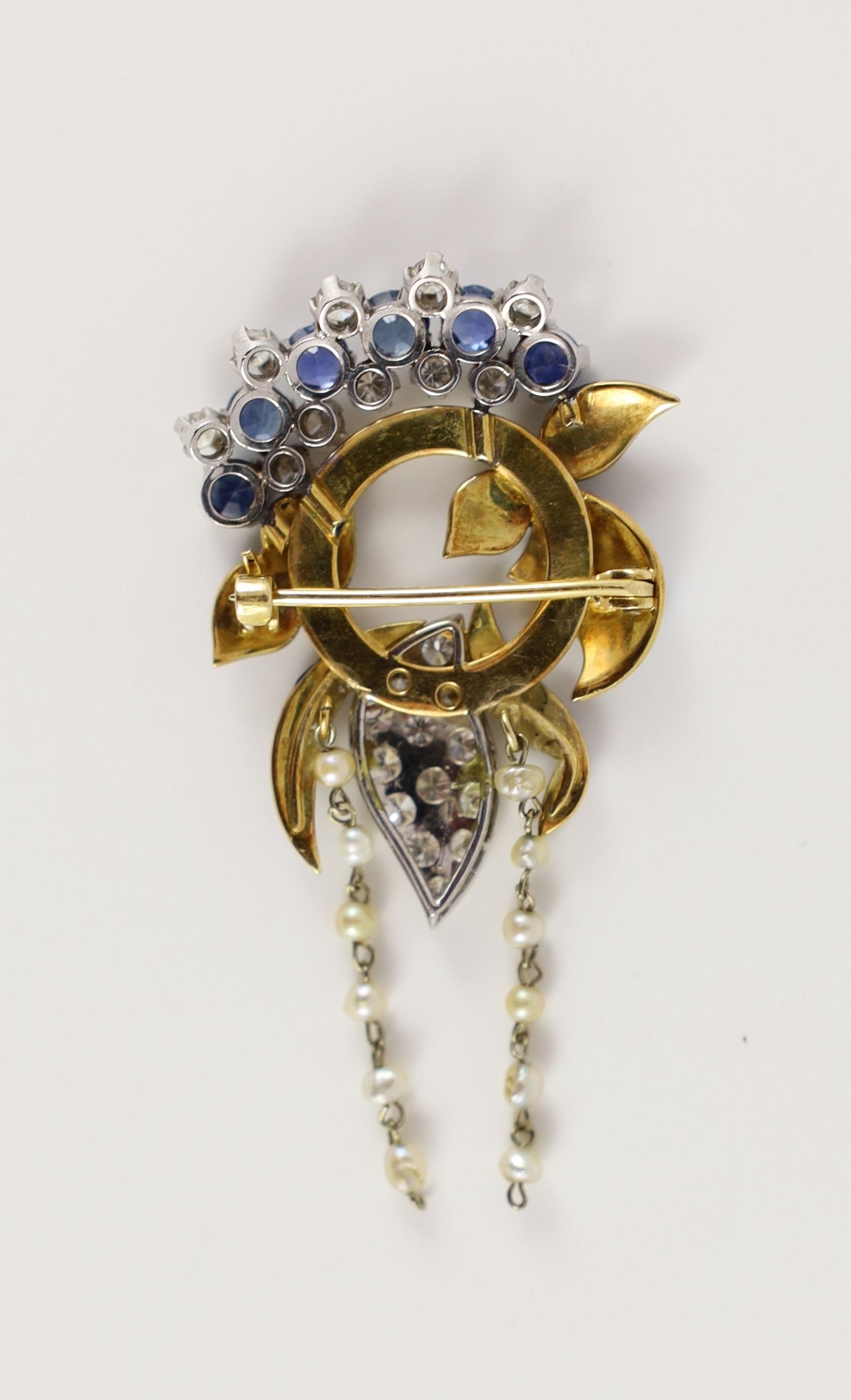 A 20th century textured gold, blue enamel, sapphire, diamond and twin seed pearl tassel set drop brooch